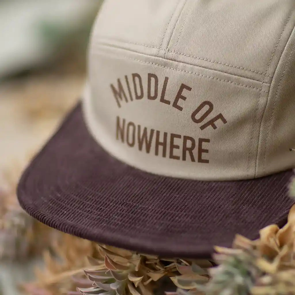 The Quiet Life Middle Of Nowhere 5 Panel Camper Hat, tan — available at Norwood