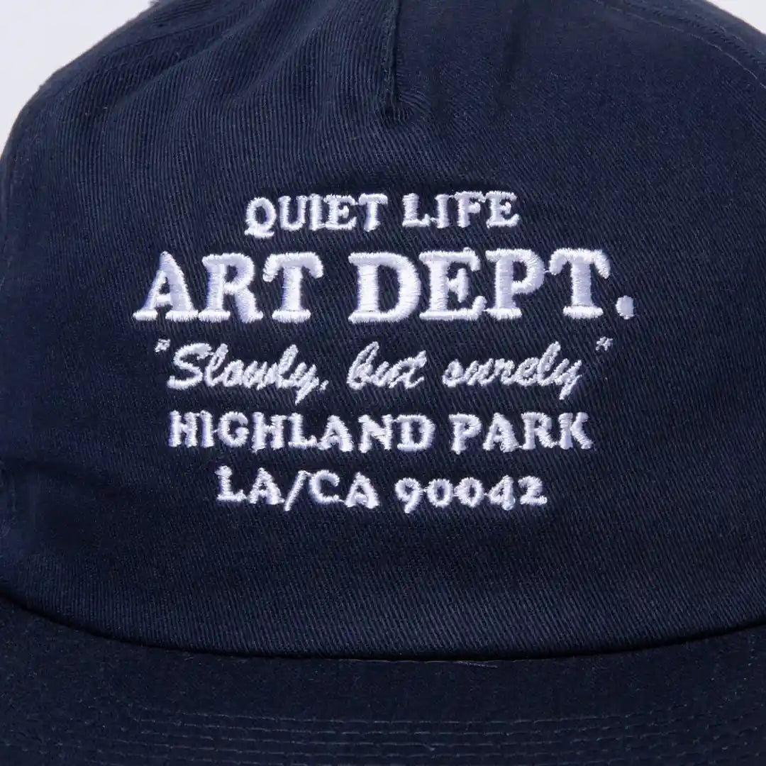 The Quiet Life Art Department Relaxed Snapback Hat, navy — available at Norwood