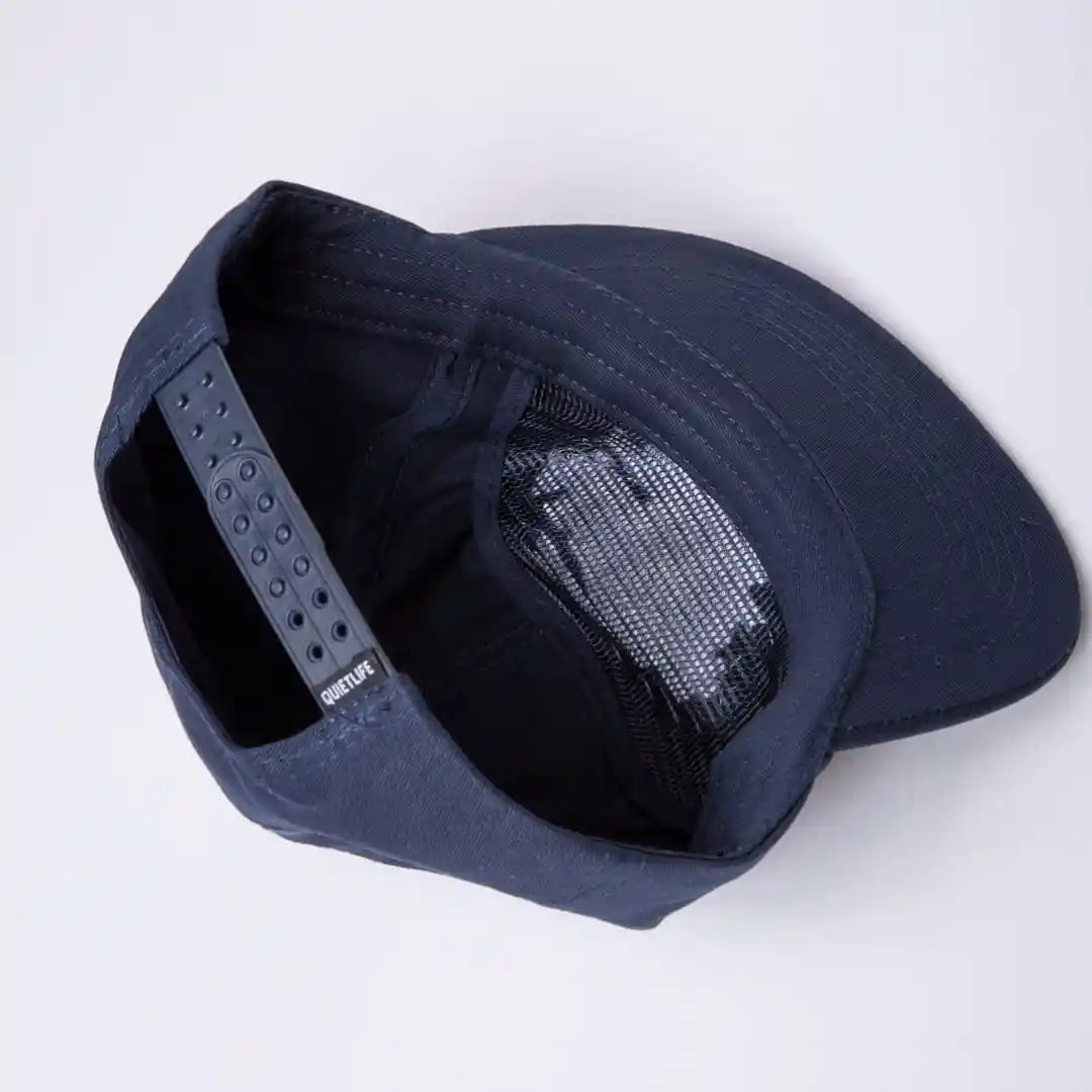 The Quiet Life Art Department Relaxed Snapback Hat, navy — available at Norwood