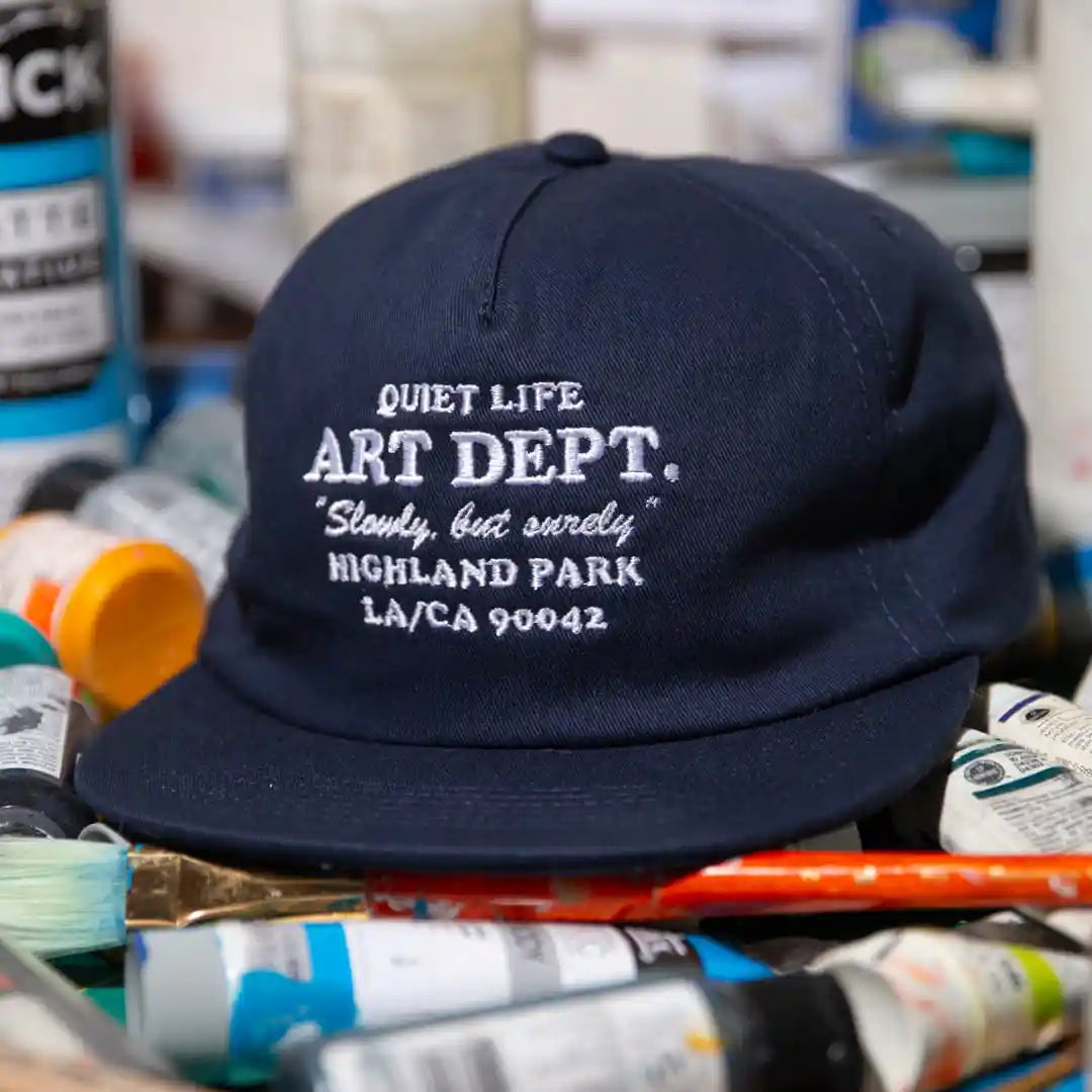 The Quiet Life Art Department Relaxed Snapback Hat, navy — available at Norwood