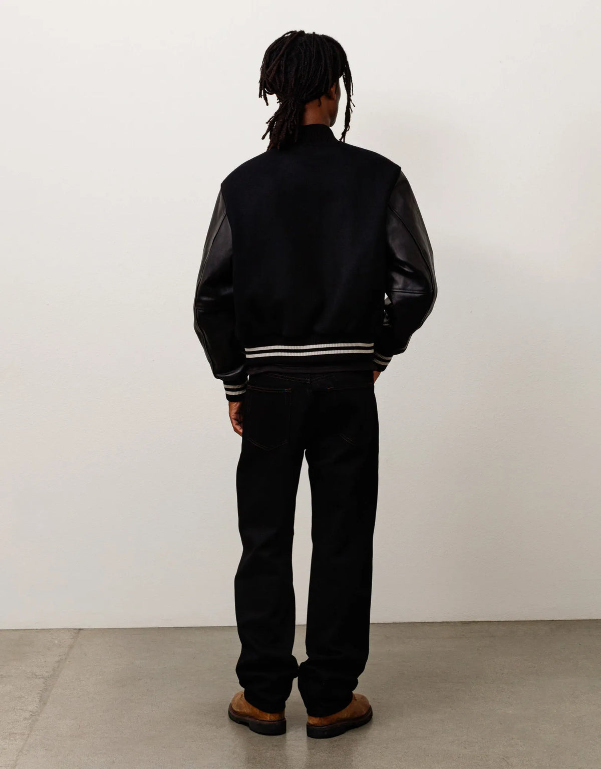 Stussy Wool Varsity, black — available at Norwood