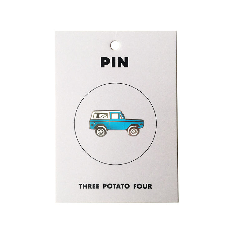 Three Potato Four Jeep enamel pin — available at Norwood