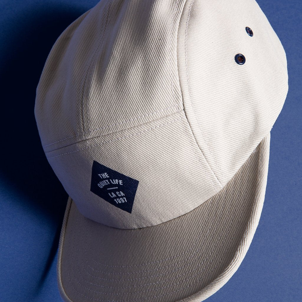Quiet Life Traveler 5 panel hat, stone — available at Norwood