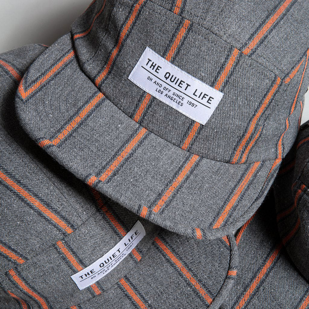 Quiet Life Striped Flannel 5 panel hat, grey/orange — available at Norwood