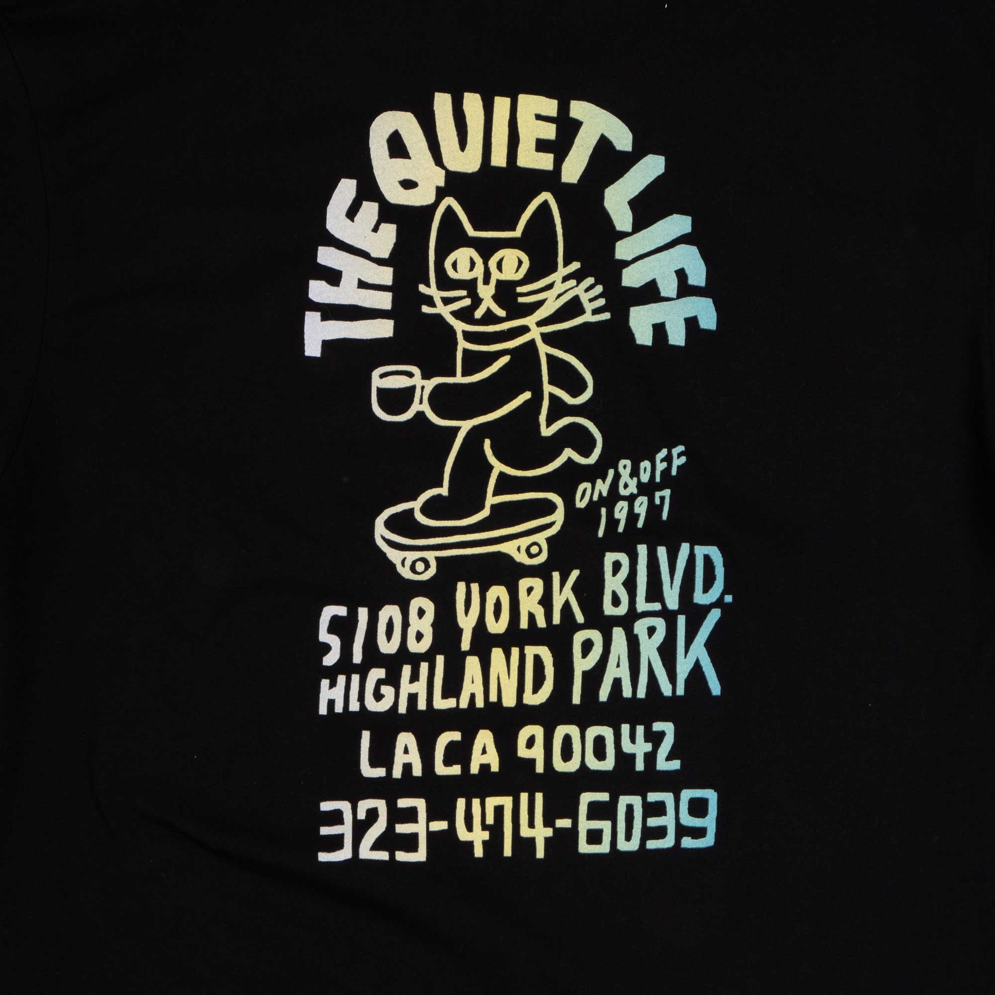 The Quiet Life Skating Cat Premium Shop T — available at Norwood