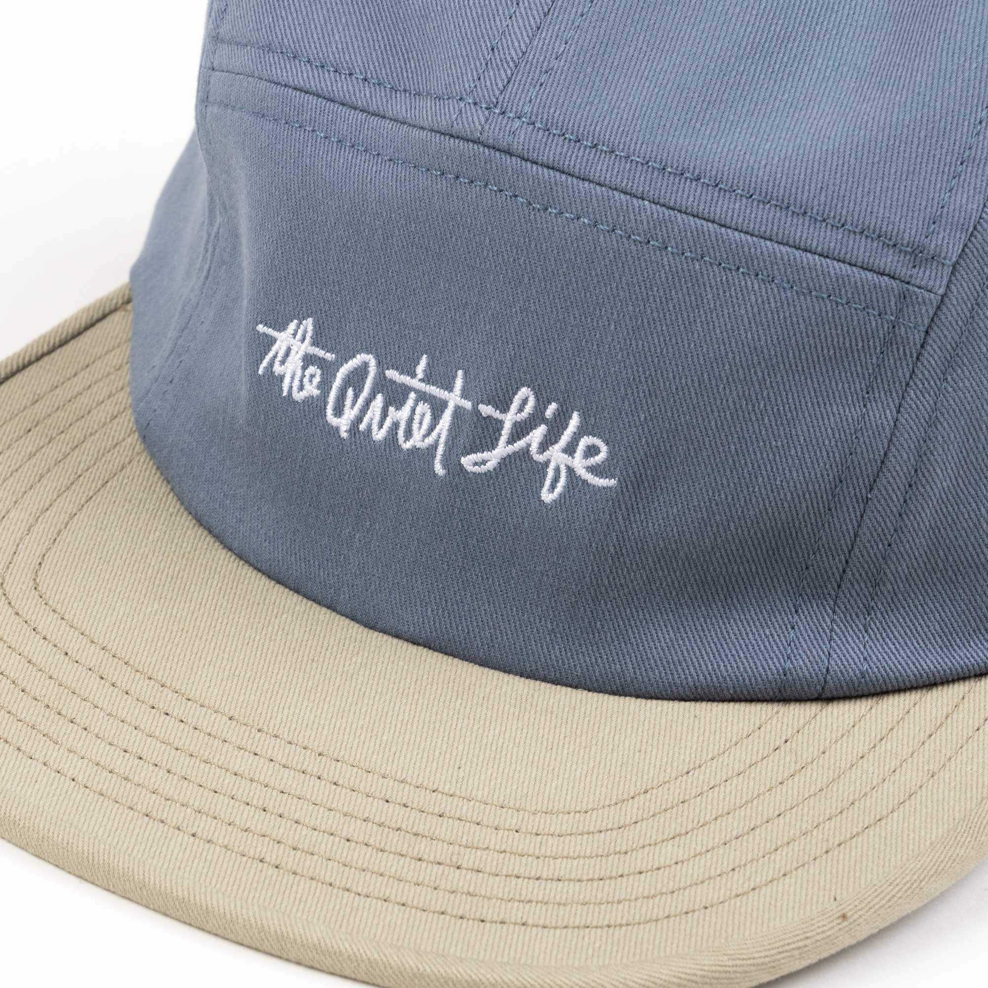 The Quiet Life Horizon Script 5 Panel Camper Hat, slate/khaki — available at Norwood