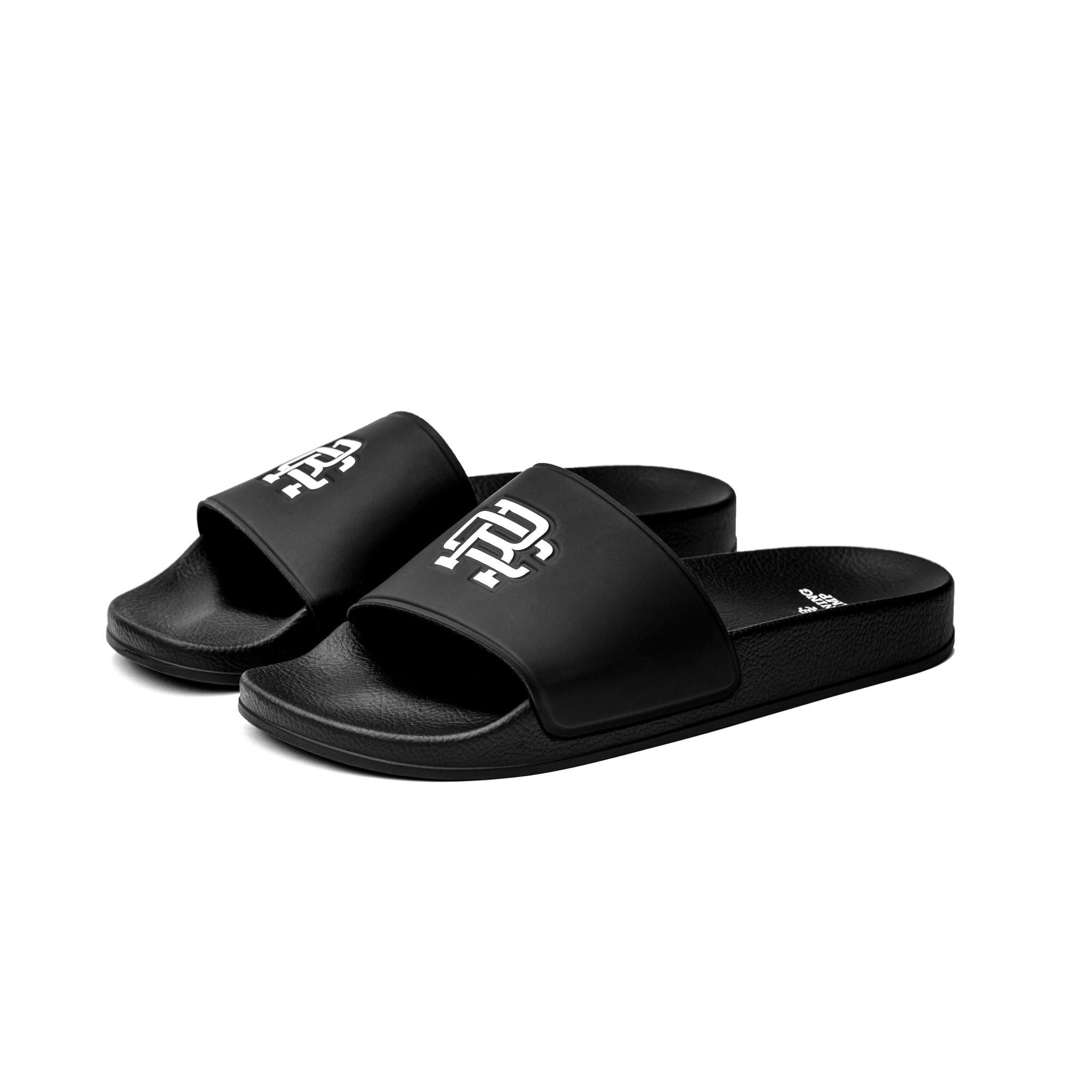 Reigning Champ Monogram Slides — available at Norwood