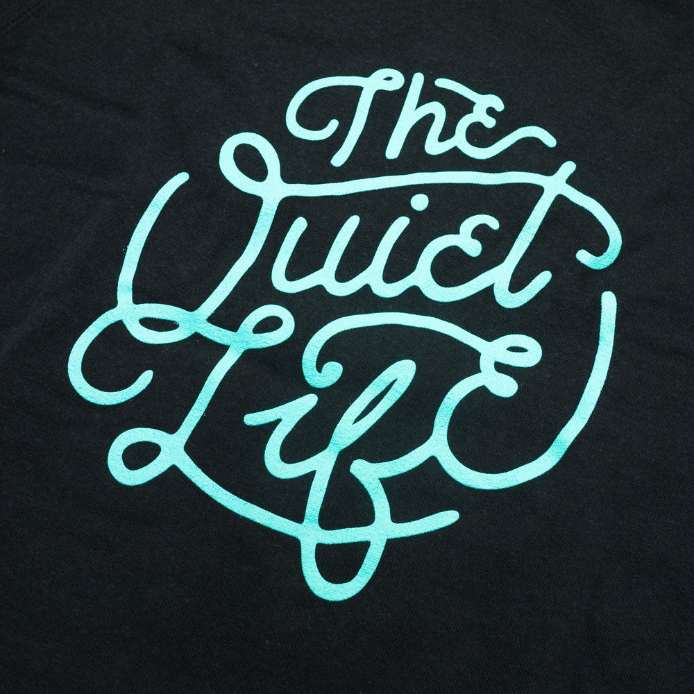 The Quiet Life Day Logo crewneck — available at Norwood
