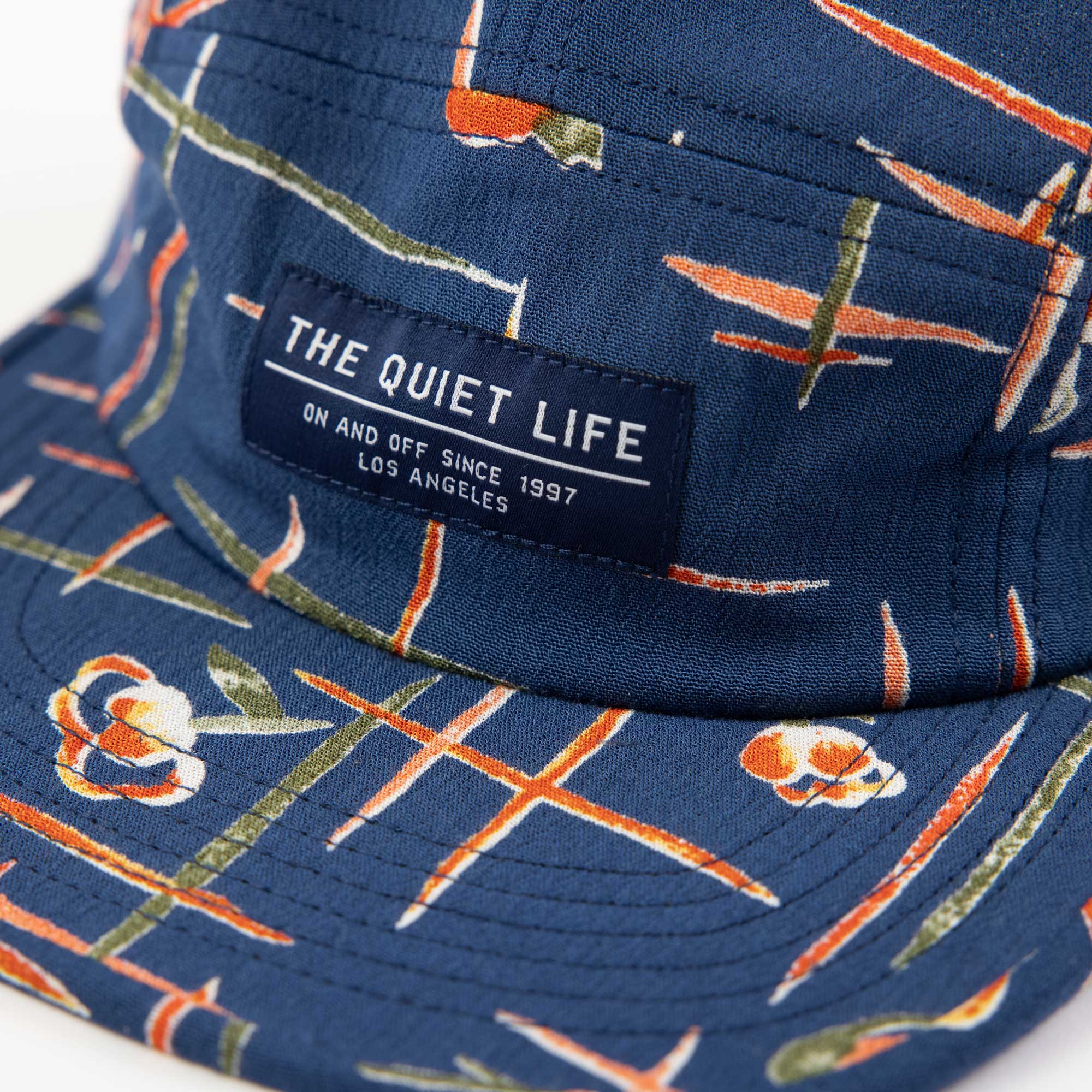 Quiet Life Deco 5 panel hat, blue/orange — available at Norwood