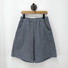 CUB Alia Long Shorts, indigo engineer stripe — available at Norwood