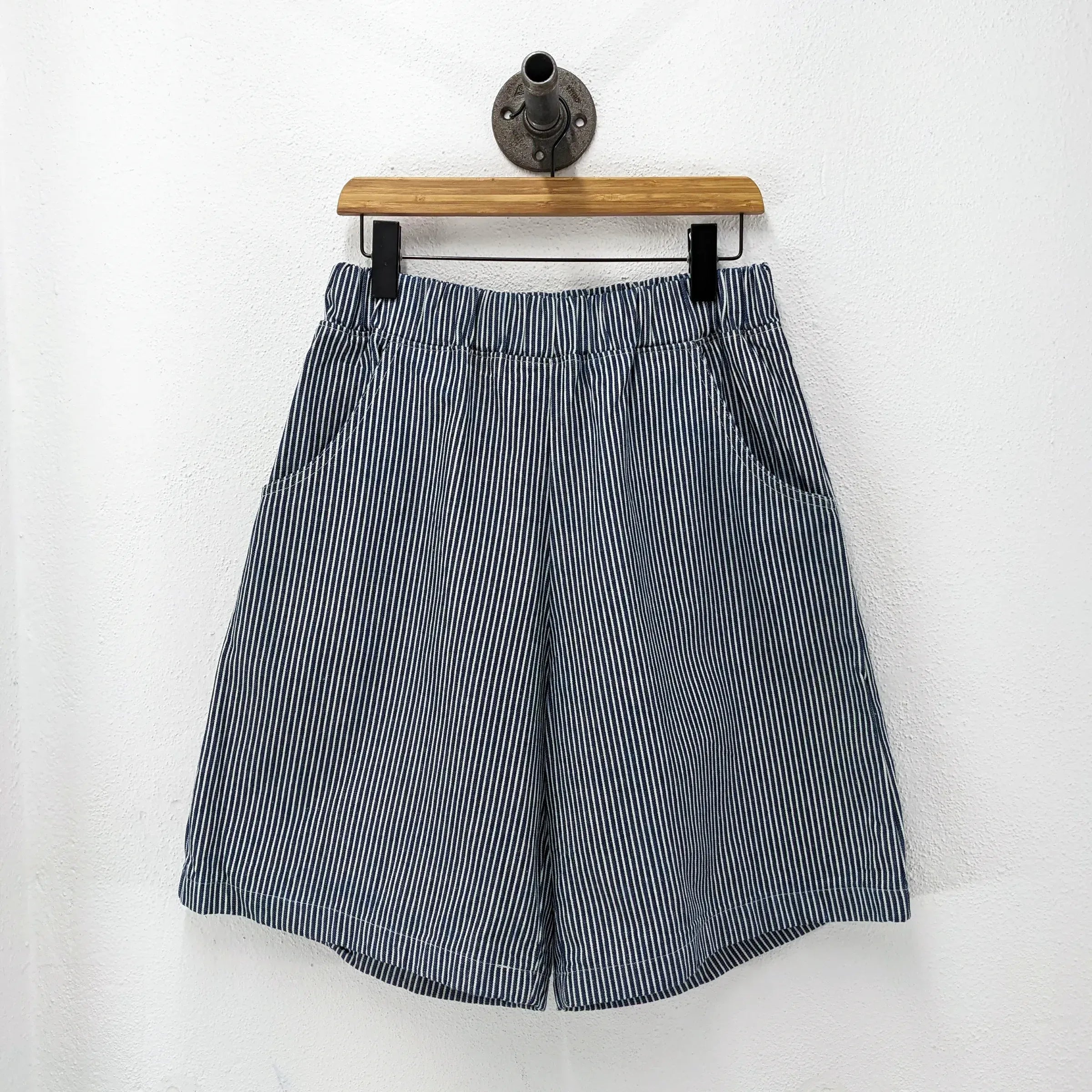 CUB Alia Long Shorts, indigo engineer stripe — available at Norwood