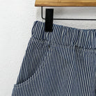 CUB Alia Long Shorts, indigo engineer stripe — available at Norwood