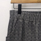 CUB Brett Pants, black plaid corduroy — available at Norwood