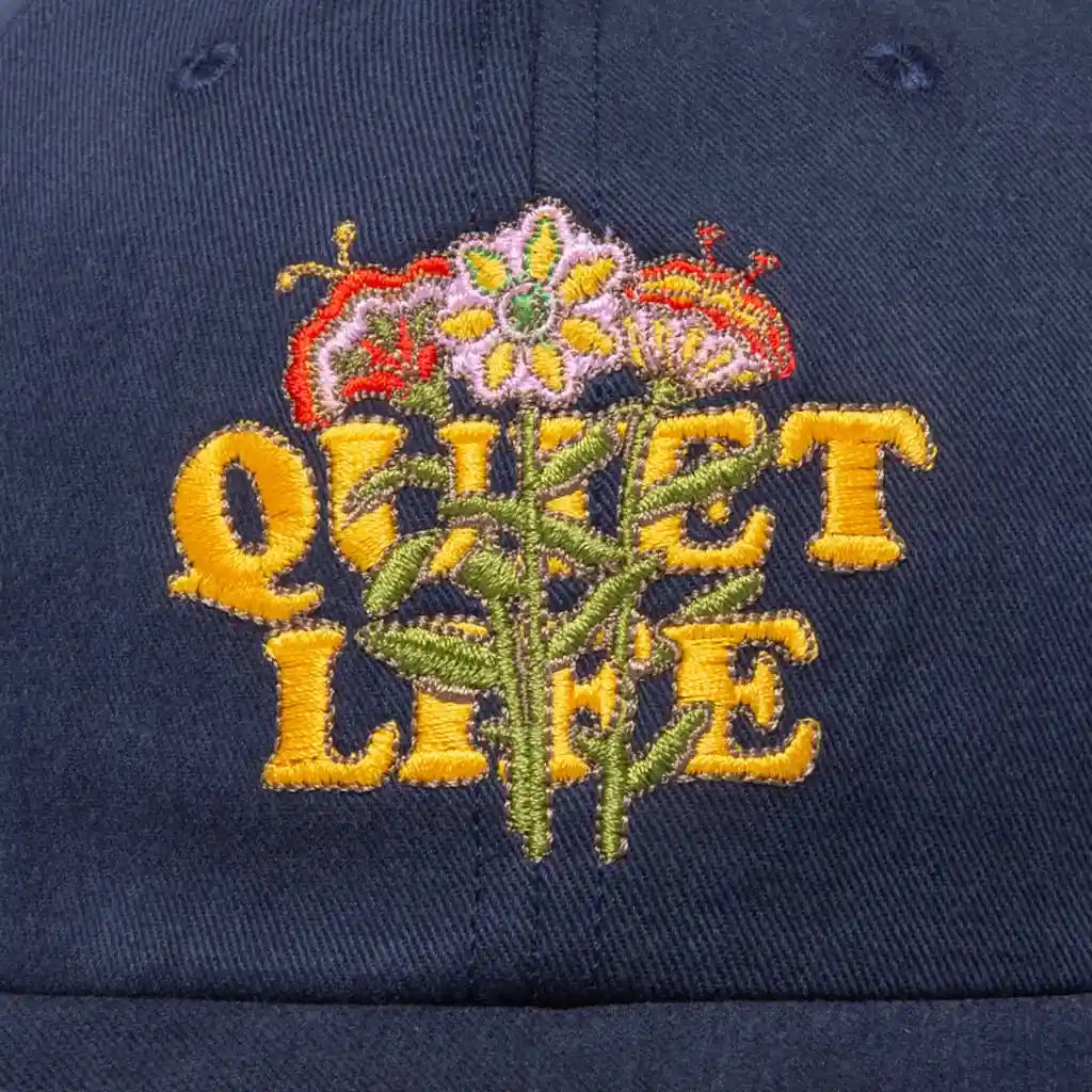 The Quiet Life Everyday Bouquet Polo Hat, navy — available at Norwood