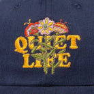The Quiet Life Everyday Bouquet Polo Hat, navy — available at Norwood