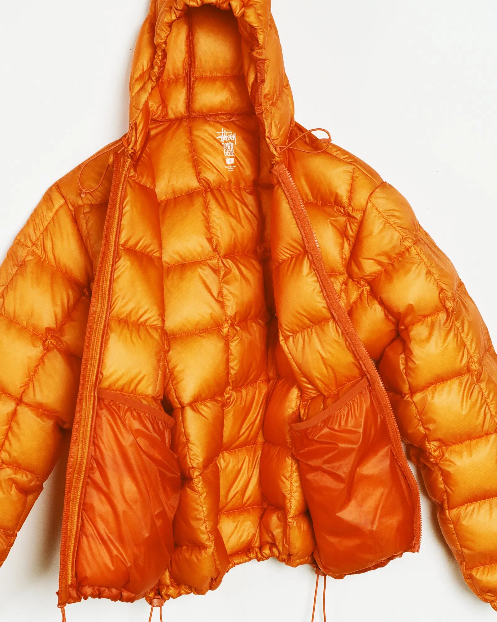 Stussy Midweight Hooded Puffer, orange — available at Norwood