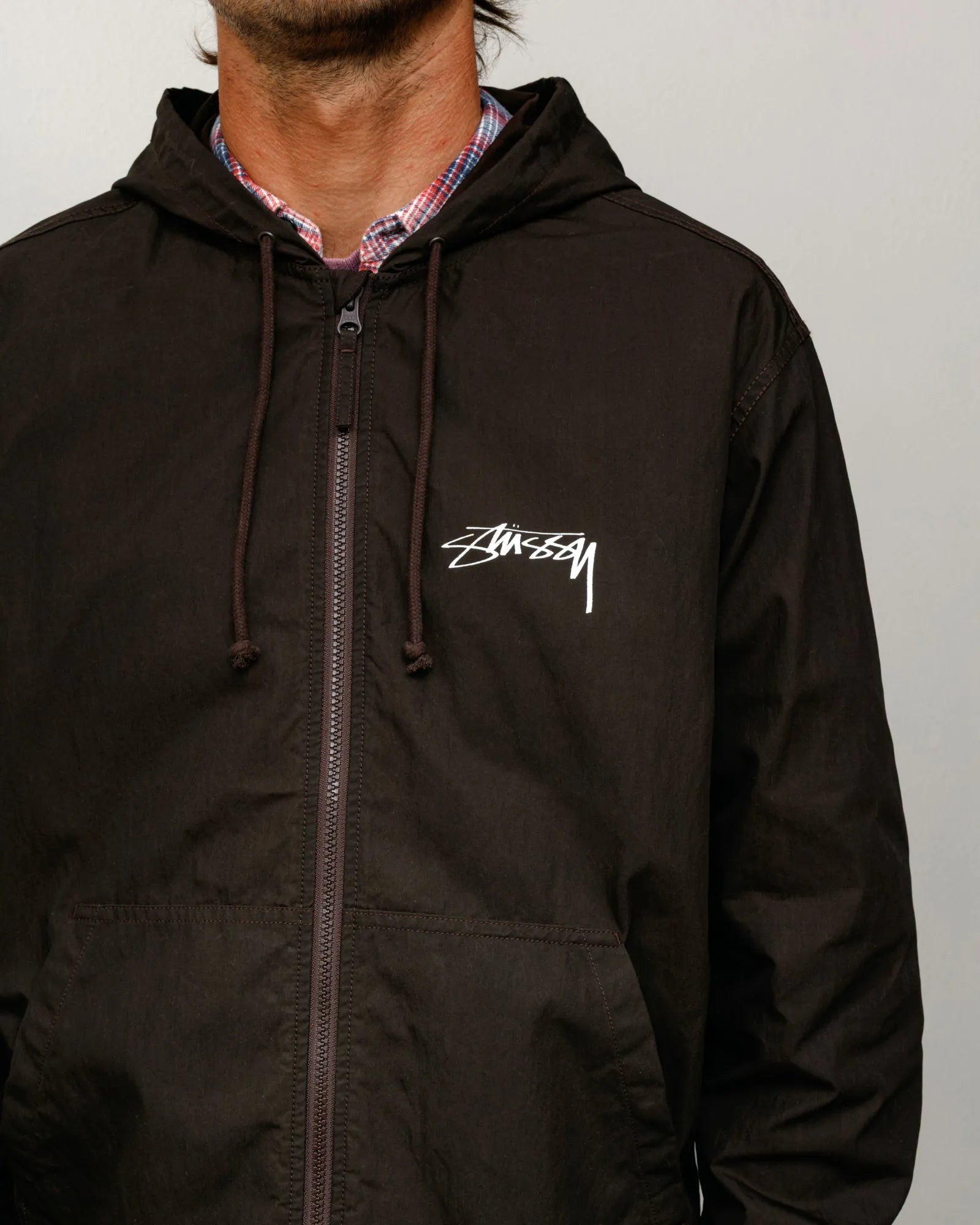 Stussy Waxed Cotton Beach Shell, brown — available at Norwood