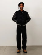 Stussy Wool Varsity, black — available at Norwood