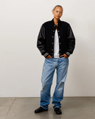 Stussy Wool Varsity, black — available at Norwood