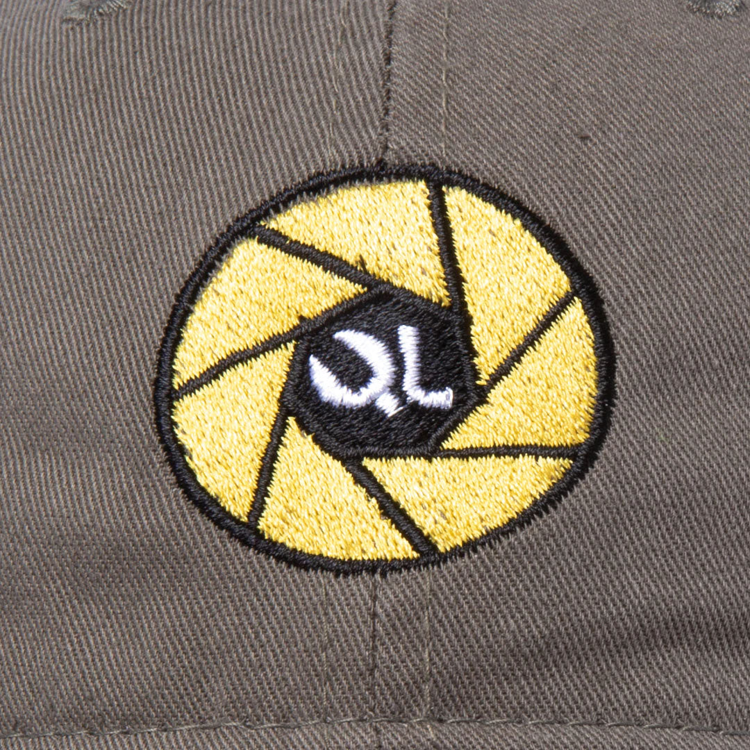 The Quiet Life Camera Club Dad Hat, Olive — available at Norwood