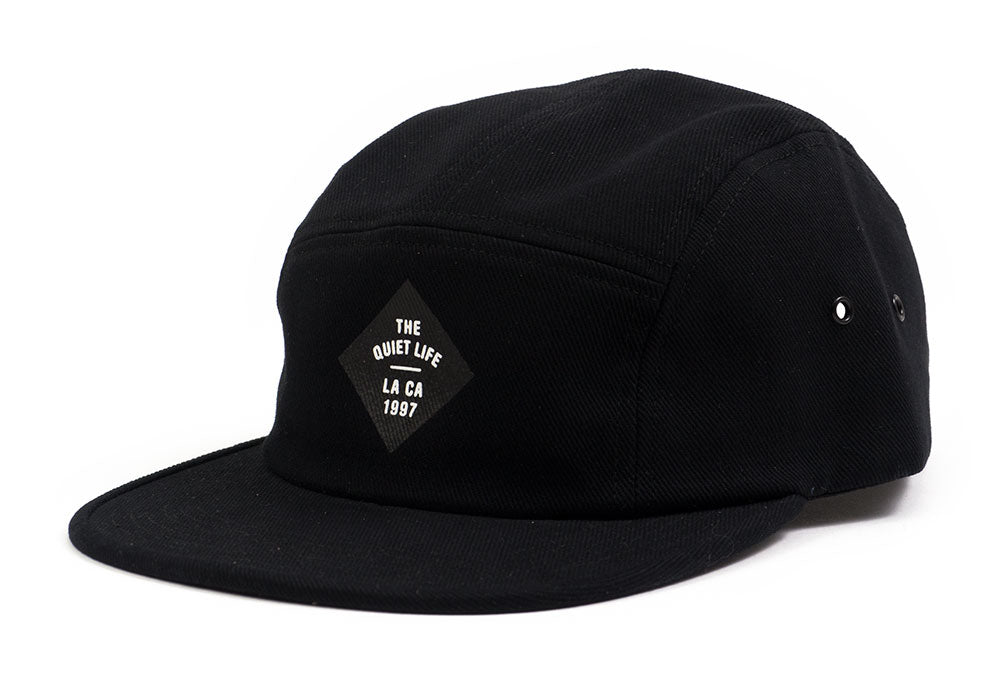 Quiet Life Traveler 5 panel hat, black — available at Norwood